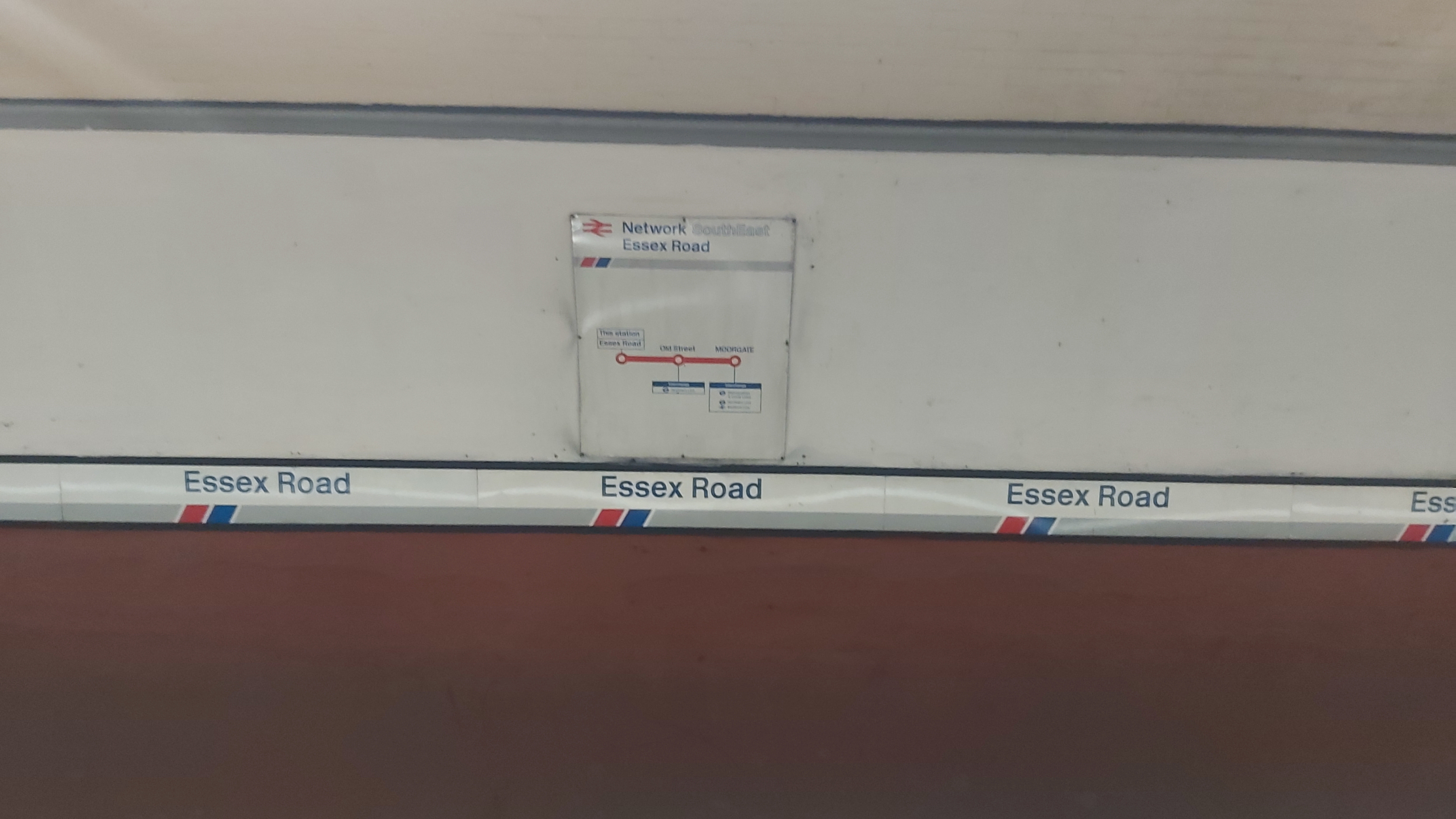 A Network SouthEast-era route map on the outside wall of the southbound platforms at Essex Road station, showing only Old Street and Moorgate.